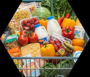 A supermarket trolley filled with fresh groceries