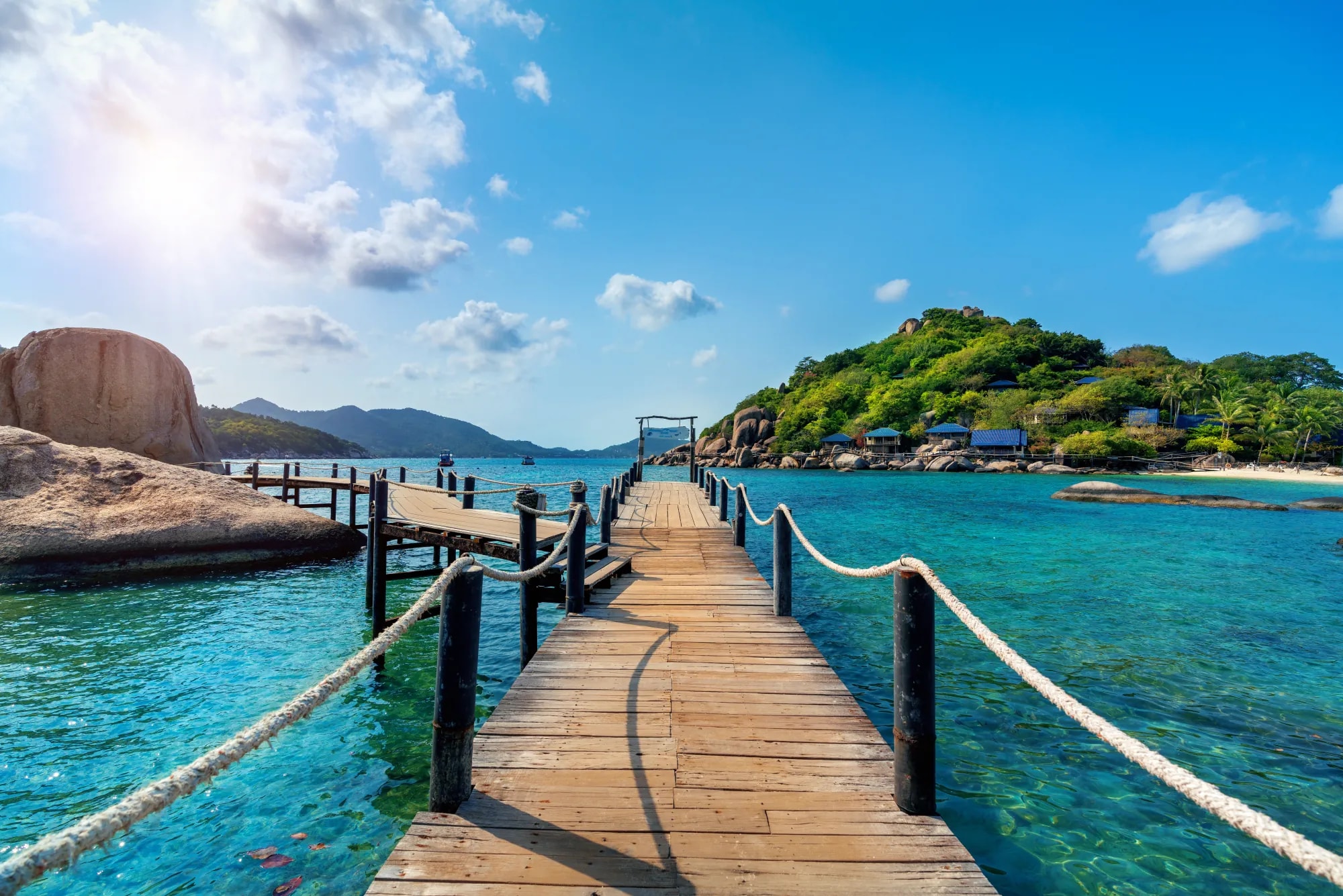 Wooden bridge leading to a tropical island
